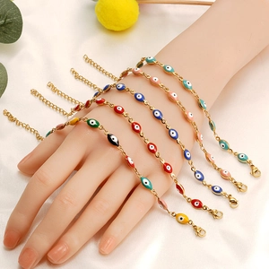 Detail of five colorful enamel evil eye bracelets with adjustable gold plated chains