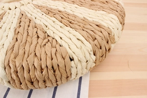 Close-up of dual-tone woven paper rope texture on a handmade beach handbag