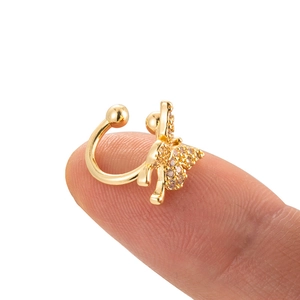 Macro shot of gold butterfly ear cuff with micro-pave zircons and U-shaped clip