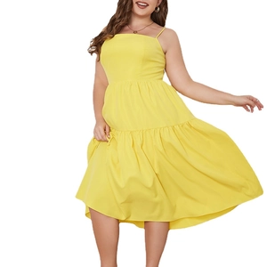 Sleeveless yellow tiered maxi dress with bow straps and a flowing layered skirt