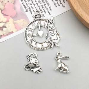 Macro shot of antique silver Easter bunny charms for DIY jewelry making and earrings
