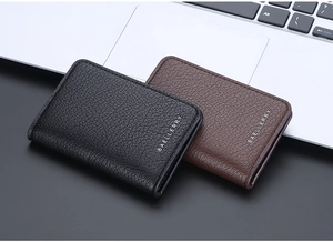 Close-up of black and brown litchi pattern leather slim wallets with metal logo