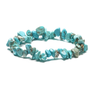 Close-up of irregular turquoise stones with natural brown veins on a minimalist bracelet