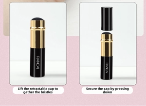 Close-up of portable retractable makeup brush showing push-pull mechanism and protective cap