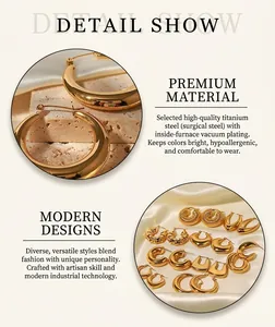 Detail of gold stainless steel hoop earrings set with vacuum plating on silk background