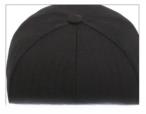 Macro detail of high-density herringbone fabric and stitching on a black baseball cap top