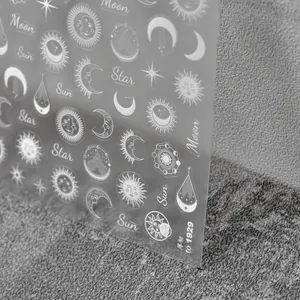 Macro detail of sun moon and star nail art stickers with ultra-thin flexible texture