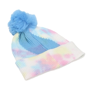 Women's winter tie-dye knit beanie with blue faux fur pom-pom and ribbed texture