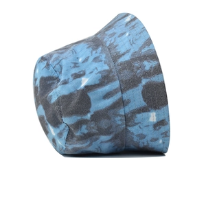 Detail view of tie-dye bucket hat with blue and grey marble print and reinforced stitching