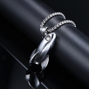 Silver rocket pendant necklace for men with sleek round box chain on dark metallic display
