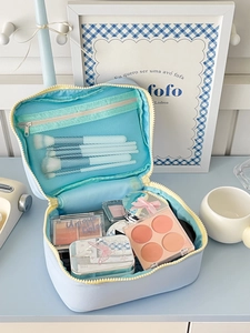 Light blue double-layer travel makeup bag with mesh brush slots and large capacity