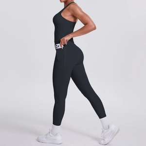 Detail of black high-waisted yoga pants featuring a practical functional side phone pocket