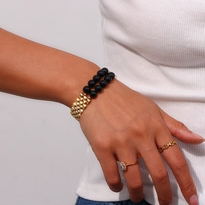 Detail of 13mm wide stainless steel watch-style bracelet with natural black stones
