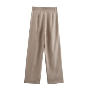 Detail of khaki high-waisted wide-leg trousers with drape fabric and belt loops
