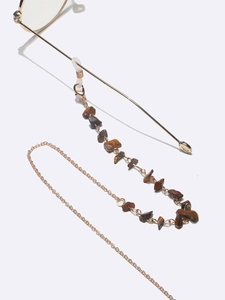 Detail of brown tiger eye stone beads and gold chain link for eyewear strap