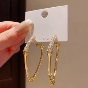 Golden heart-shaped bamboo earrings with S925 silver posts and sparkling rhinestones