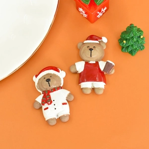 Macro detail of two colorful resin Christmas bears for DIY crafts and decorations
