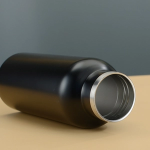 Macro detail of black matte stainless steel water bottle with wide silver mouth opening