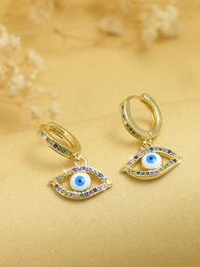 Macro view of gold evil eye earrings with colorful zircon inlay and micro-pave crystals