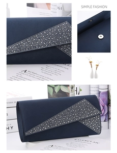Detail of navy blue satin clutch with V-shaped rhinestone inlay and magnetic closure