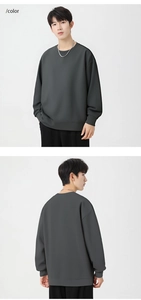 Front and back views of a men's dark grey waffle knit sweatshirt with loose drop shoulders