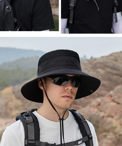 Detail of black outdoor sun hat featuring breathable mesh crown and adjustable wind cord
