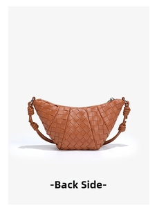 Detail of hand-woven caramel crescent bag showing back view and intricate leather texture