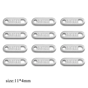 Macro detail of 11x4mm stainless steel jewelry tags with S.STEEL stamp for DIY crafts