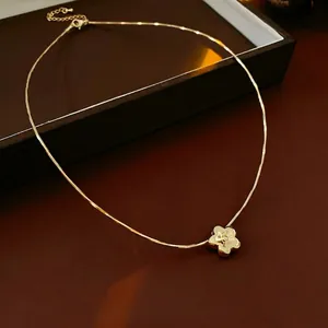 Elegant gold plated flower necklace with cubic zirconia on a chic snake chain link