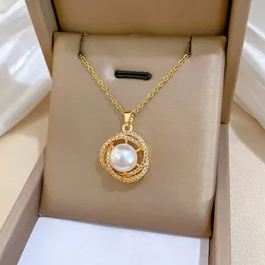 Gold titanium steel nest necklace with pearl and sparkling pavé crystals on silk