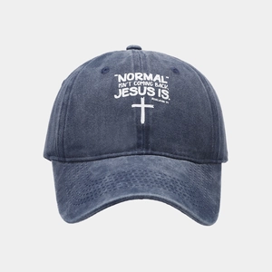 Close-up of religious text and cross print on washed navy blue cotton baseball cap