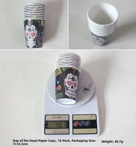 Detail of Mexican Day of the Dead paper cups with colorful sugar skull and floral patterns