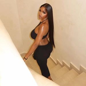 Slim fit black backless bodysuit paired with extra long natural black straight hair wig