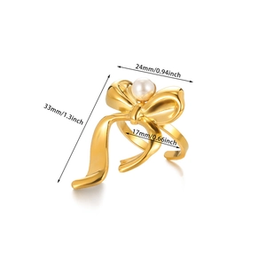 Gold bow-shaped pearl ring with adjustable open design and matte finish details