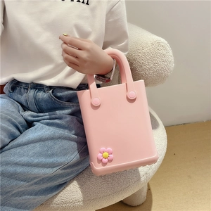 Pink EVA jelly tote bag with decorative yellow flower for summer beach vacations