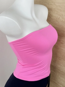 Close-up of pink seamless tube top showing elastic knit texture and slim fit design