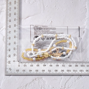 Detailed view of starfish necklace set in packaging with measuring ruler for size scale