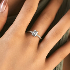 Exquisite S925 sterling silver emerald cut engagement ring with pave side stones
