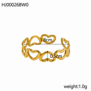 Detail view of adjustable gold heart ring showing 1.8cm diameter and 0.5cm width dimensions