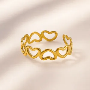 Detail view of adjustable gold heart ring showing 1.8cm diameter and 0.5cm width dimensions