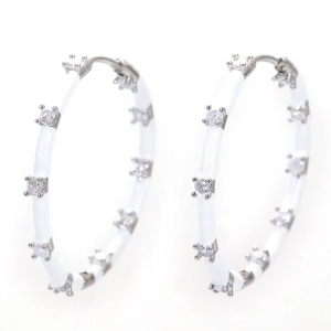Detail of silver hoop earrings with white enamel coating and micro-set zircon crystals