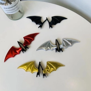 Set of bat wing hair clips in black, red, silver, and gold for Halloween styling