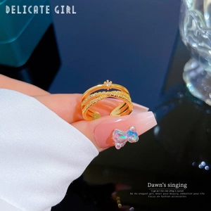 Double-layer open ring featuring zircon pave and a polished gold-plated finish