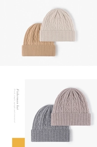 Detailed cable knit texture and ribbed cuff on colorful merino wool beanies