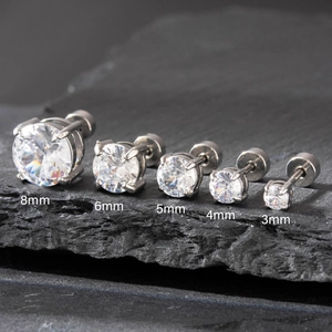 Set of 5 sparkling cubic zirconia stud earrings in sizes 3mm to 8mm on stone background