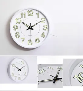 Detailed view of 12 inch luminous wall clock with clear numerals and quartz movement