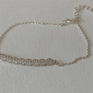 Detail of S925 sterling silver bracelet with cubic zirconia stones and lobster clasp