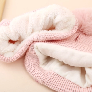 Pink girls' knitted hat and scarf set with fleece lining and fluffy pompom for winter