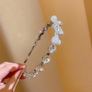 Detail view of French retro headband featuring crystal beads and faux white pearls