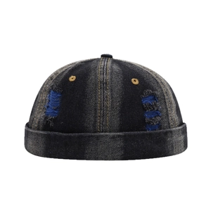 Distressed blue denim docker hat with ripped details and retro street style design